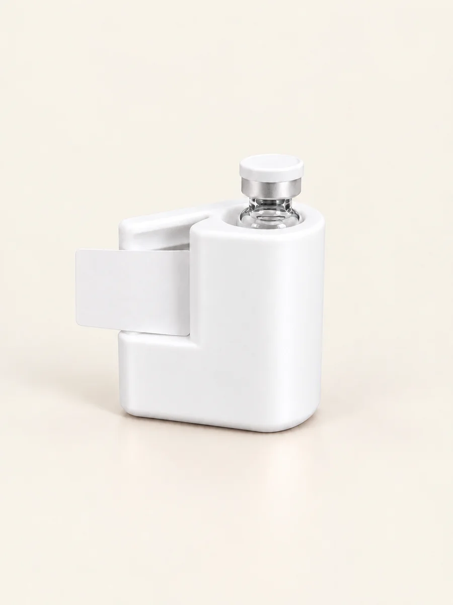 A Marshmallow White applicator shown with a vial and label for illustration
